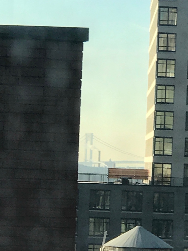 If you look hard, you can see the Brooklyn Bridge between the buildings. 